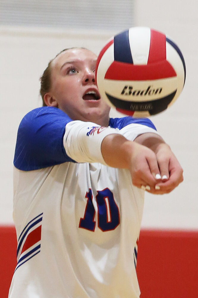 Sierra Kilts passes the ball up to a hitter during the first set against Midwest
